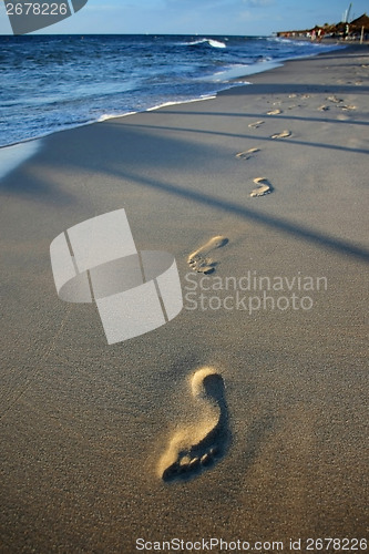 Image of Footprints in sand beach