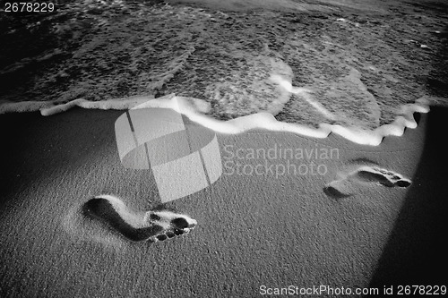 Image of Footprints on beach black and white