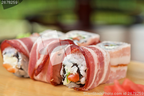 Image of Sushi roll with bacon