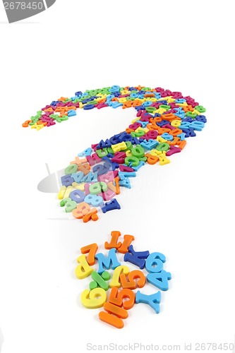 Image of color plastic letters as question sign 