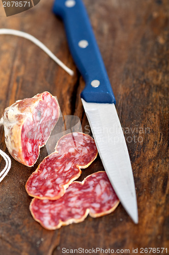 Image of italian salame pressato pressed slicing