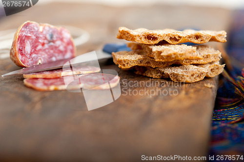 Image of italian salame pressato pressed slicing