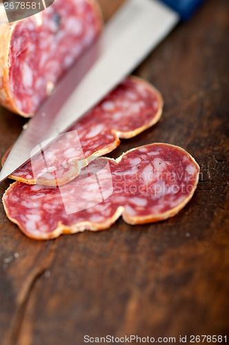 Image of italian salame pressato pressed slicing