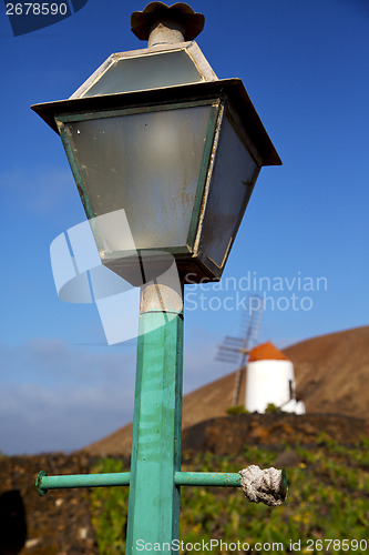 Image of windmills spain street lamp a bulb in the blue  