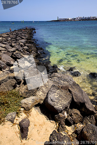 Image of pier village  water  boat yacht coastline and summer  lanzarote 