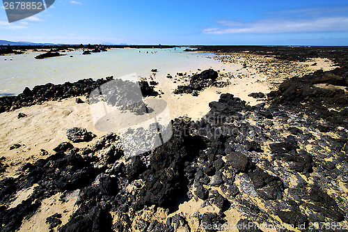 Image of people spain  hill   spiral of black rocks in the   lanzarote 