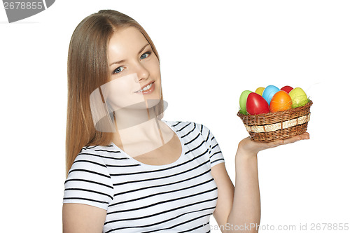 Image of Female holding basket with Easter eggs