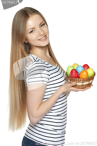 Image of Female holding basket with Easter eggs