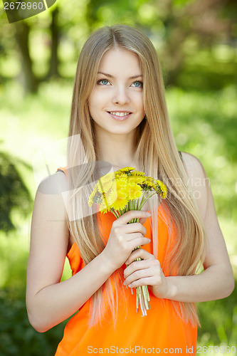 Image of Spring girl with bunch of dandelions