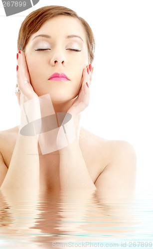 Image of lovely woman washing face