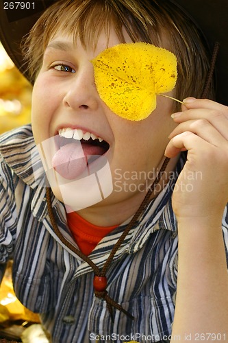 Image of Happy boy in the autumn fall