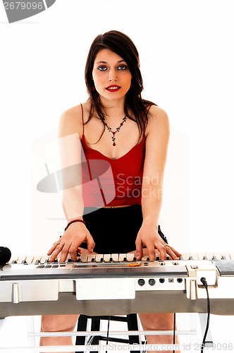 Image of Woman playing on keyboard.