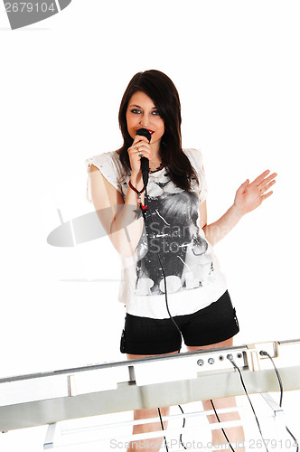 Image of Girl singing with keyboard.