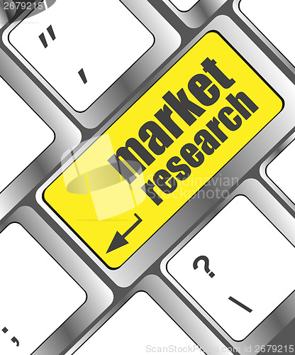 Image of key with market research text on laptop keyboard, business concept