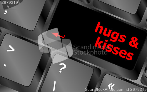 Image of hugs and kisses words on computer keyboard keys