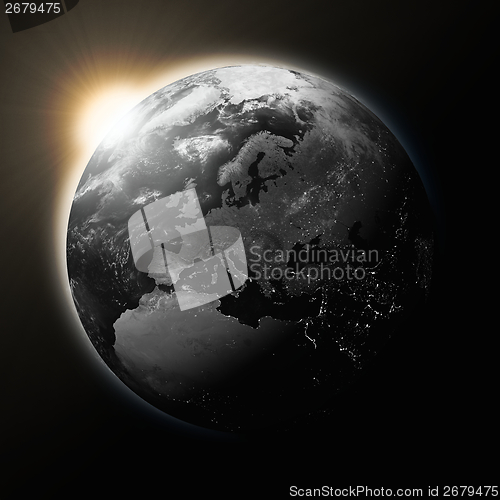 Image of Sun over Europe on dark planet Earth