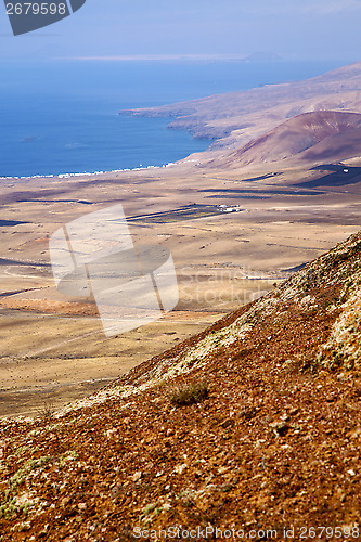 Image of coastline lanzarote  spain africa and house field 