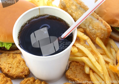 Image of Hamburgers fried potatoes and drink