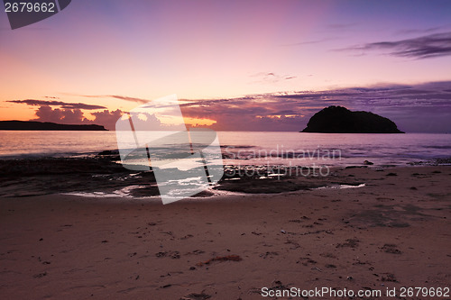 Image of Ocean dawn sunrays and silhouettes