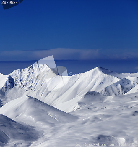 Image of View on off-piste snowy slope at nice sunny day