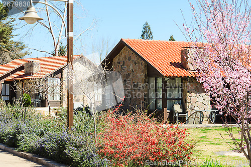 Image of Guesthouses row on spring walkway