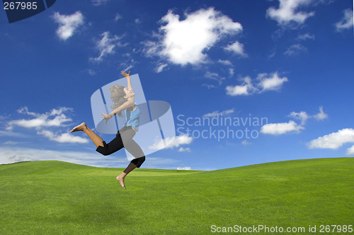 Image of Athletic woman jumping