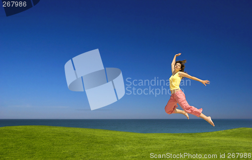 Image of Young woman jumping