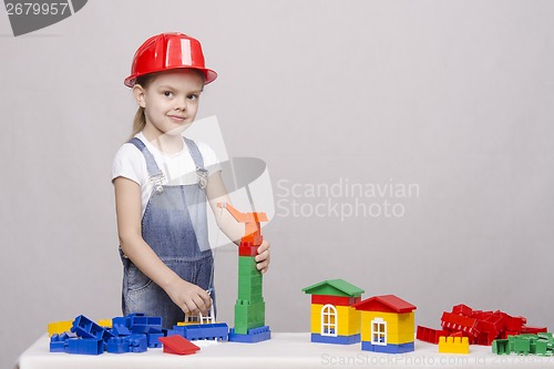 Image of Girl playing in the constructor
