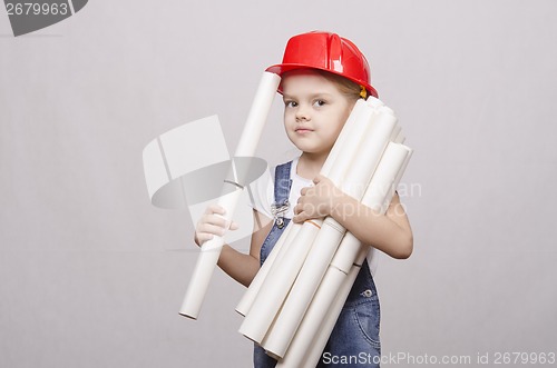 Image of Child engineer keeps many drawings