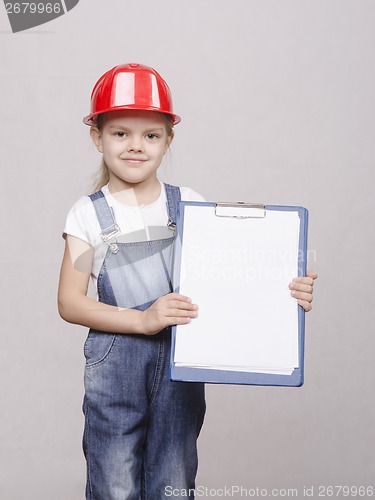 Image of Portrait of child in helmet and a folder