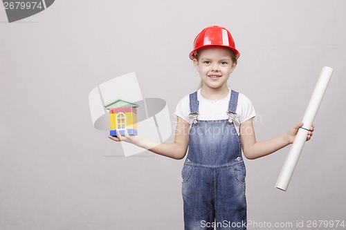 Image of Girl Builder keeps house and drawing