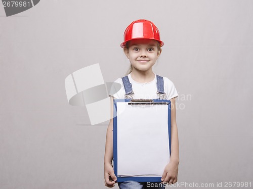 Image of Child mechanic in helmet and with folder his hands