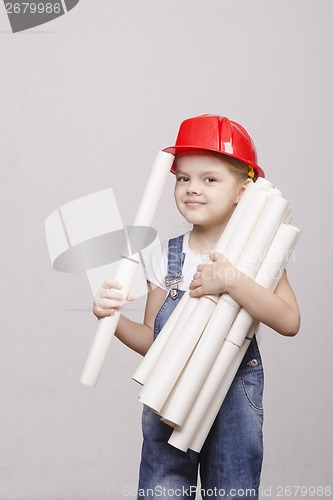 Image of The child holds a lot of drawings