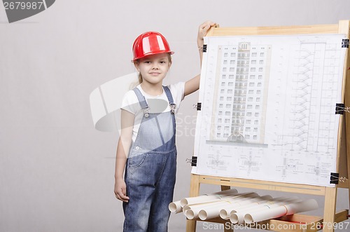 Image of The child in helmet is drawing near