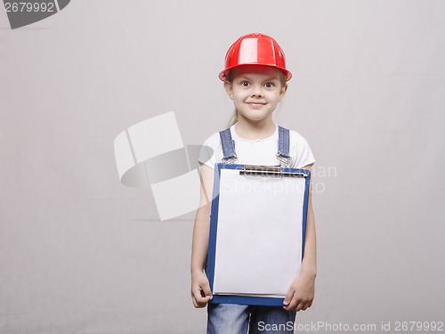 Image of The child in a helmet and with folder his hands