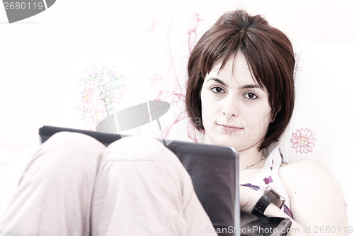 Image of Young woman with laptop 
