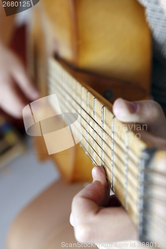 Image of Playing the guitar