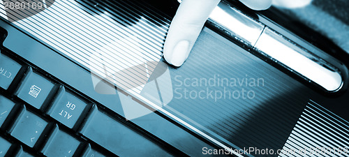 Image of Working at laptop .