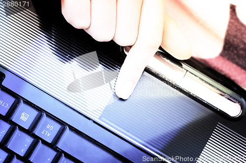 Image of Working at laptop .