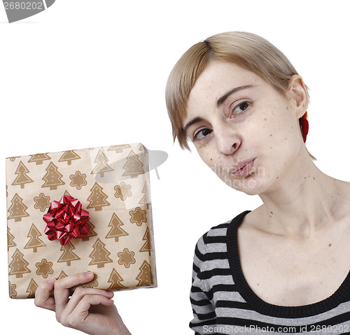 Image of Young woman holding a present