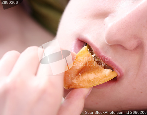 Image of Women with apricot 
