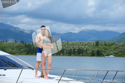 Image of young couple on yacht