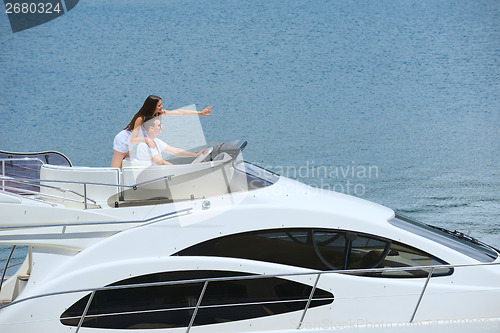 Image of young couple on yacht