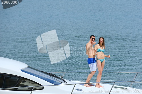 Image of young couple on yacht