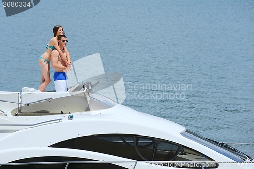 Image of young couple on yacht