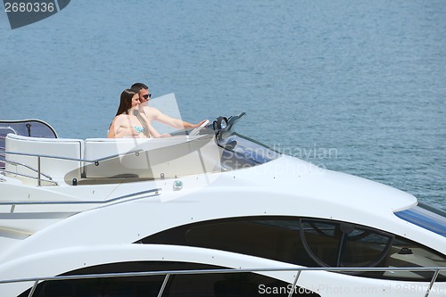 Image of young couple on yacht