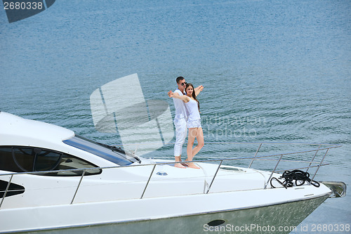 Image of young couple on yacht