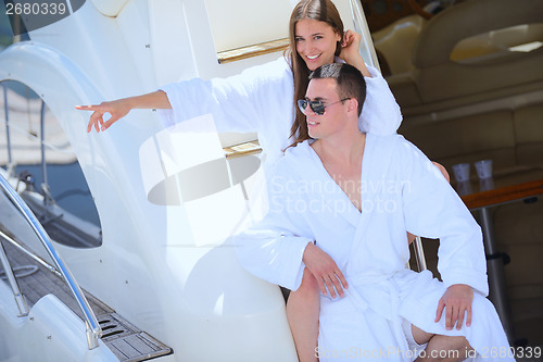 Image of young couple on yacht