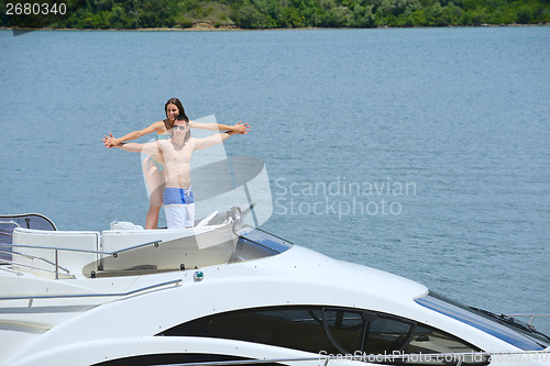 Image of young couple on yacht