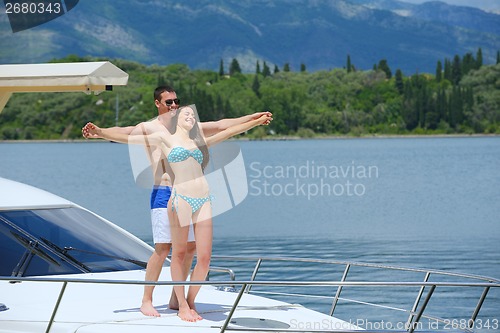 Image of young couple on yacht